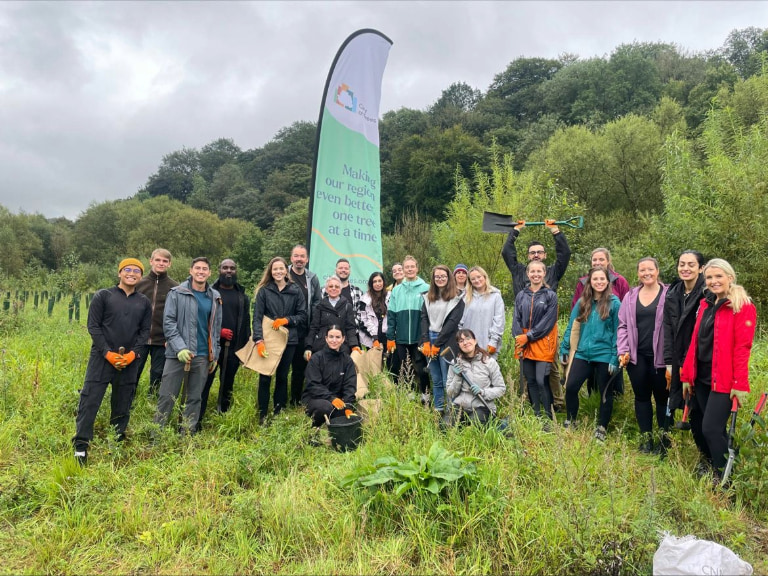 Group volunteering at tree planting event