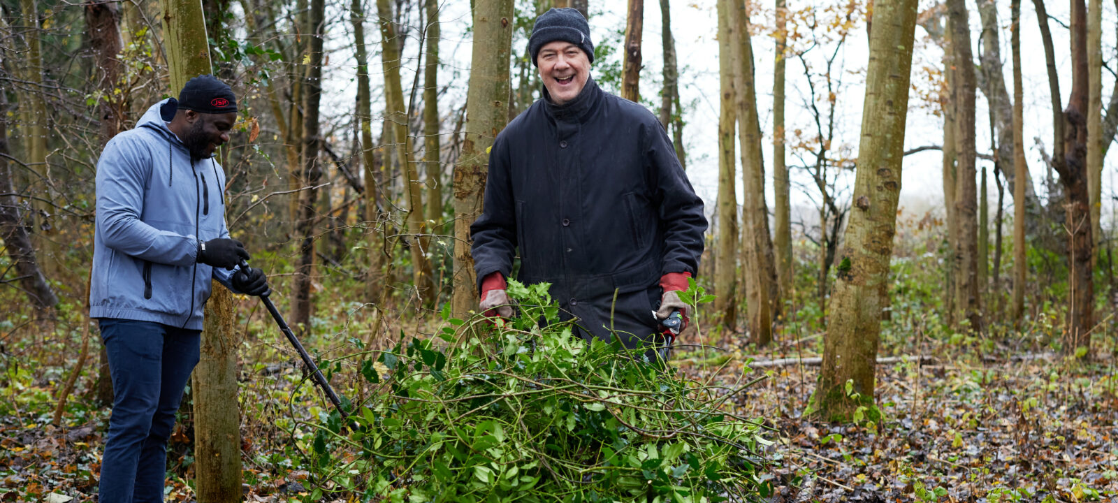 two men taking part in woodland management