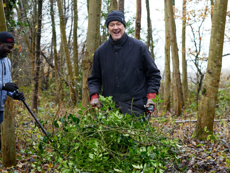 two men taking part in woodland management